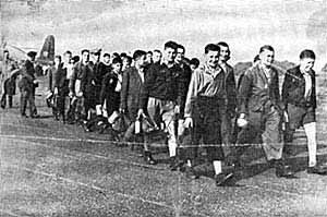 Photograph of members of the first group of the Boys arriving at Crosby-on-Eden airport in August 1945.