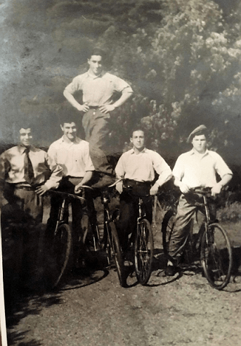 Photograph of Chiel Brauner (Henry Brown) standing on the bike.