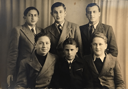 Photograph of Back row (left to right): Moscovitch, Mendel Silbertein, Unknown. Front row: Zvi Brand, Melzer, and Sam (who now lives in Canada).