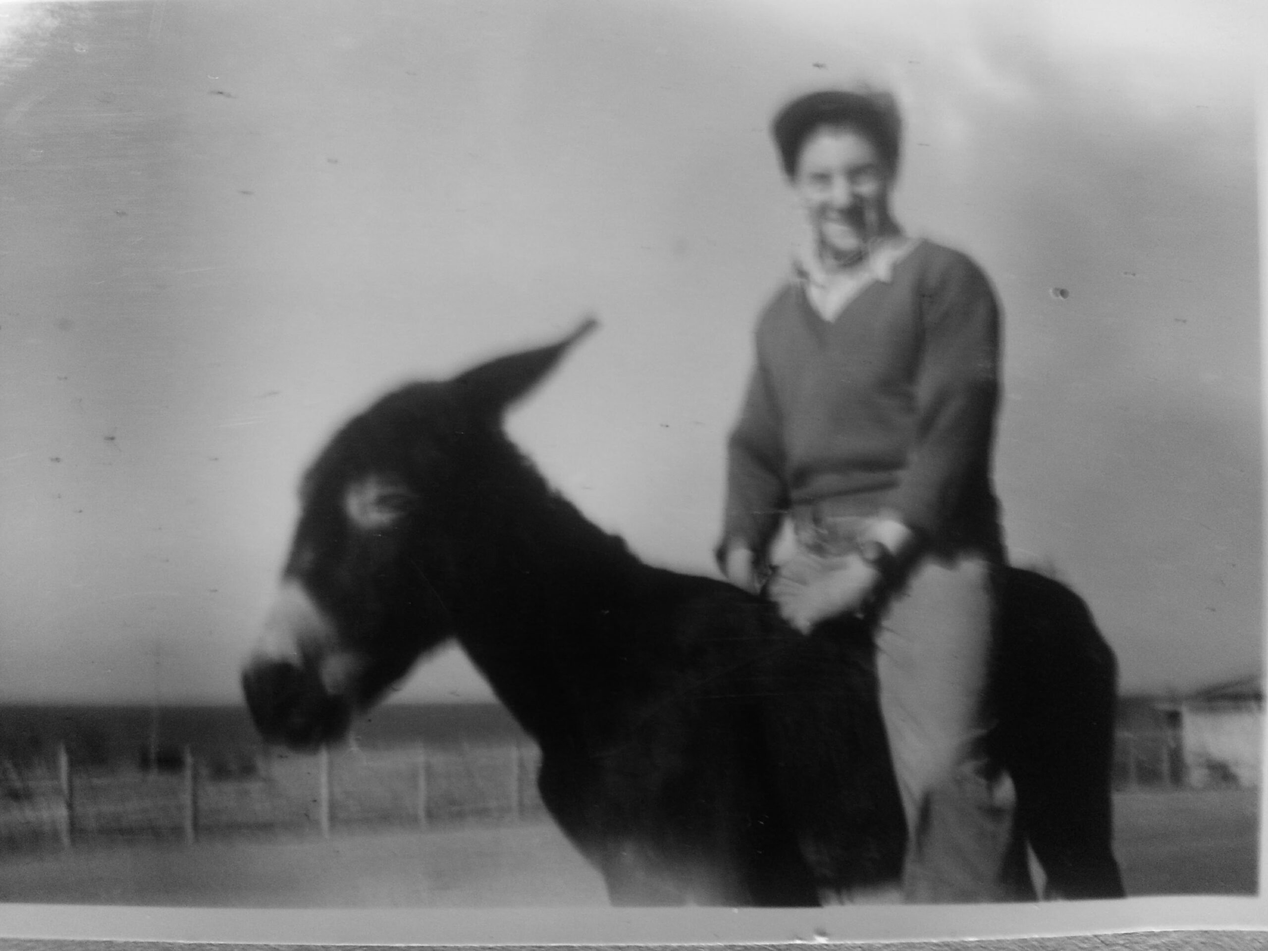 Photograph of Riding a donkey.