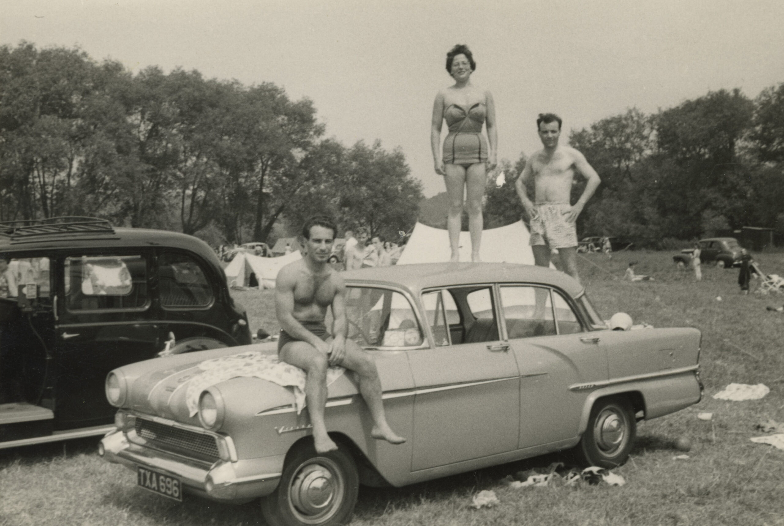Photograph of Jan Goldberger sitting on a car.