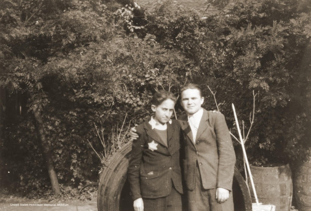 Photograph of Michael Blain (right) poses with his cousin Hershi wearing the yellow star. Budapest, Hungary, 1944.