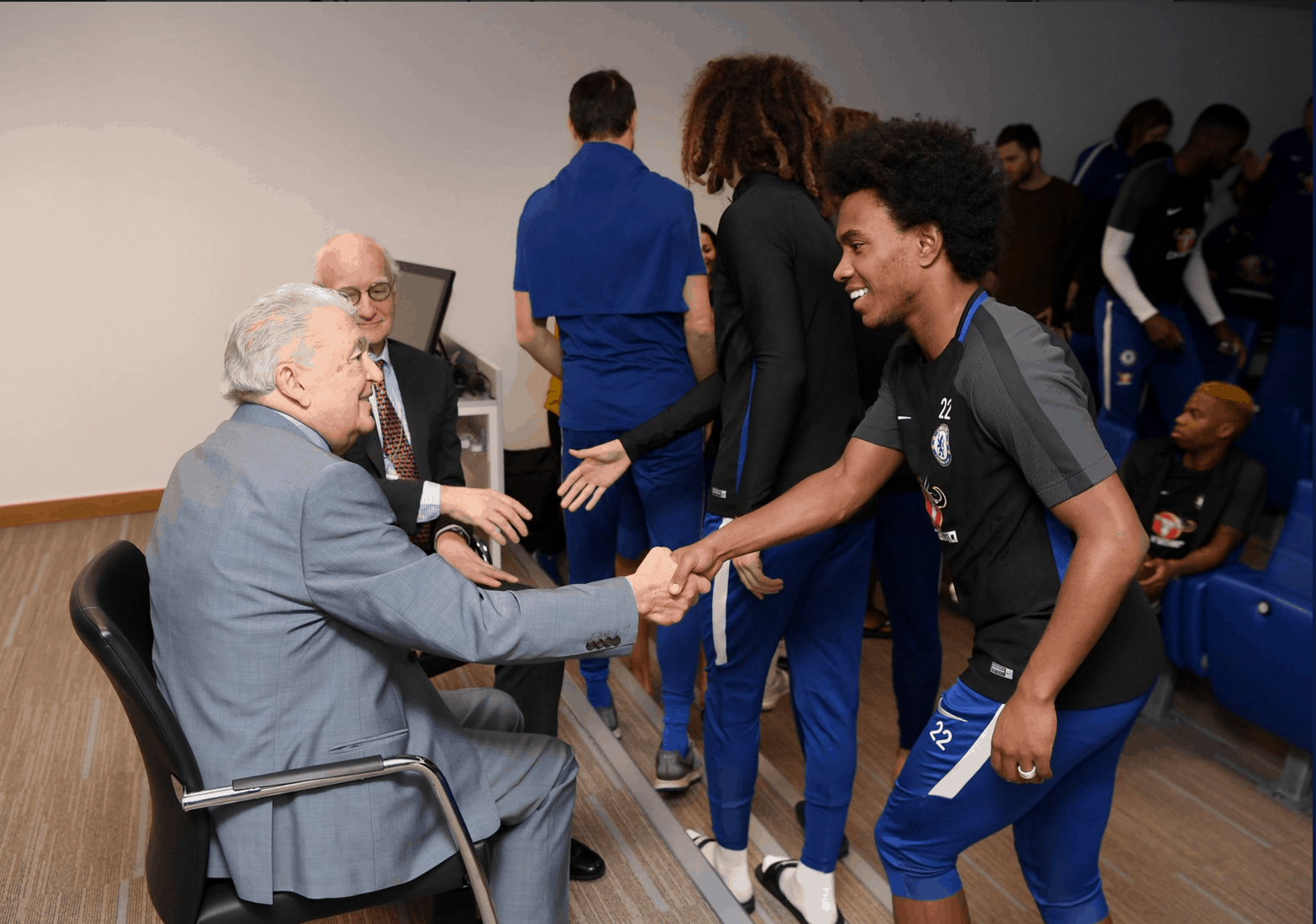 Photograph of Harry Spiro meeting footballers at Chelsea FC, 2018.