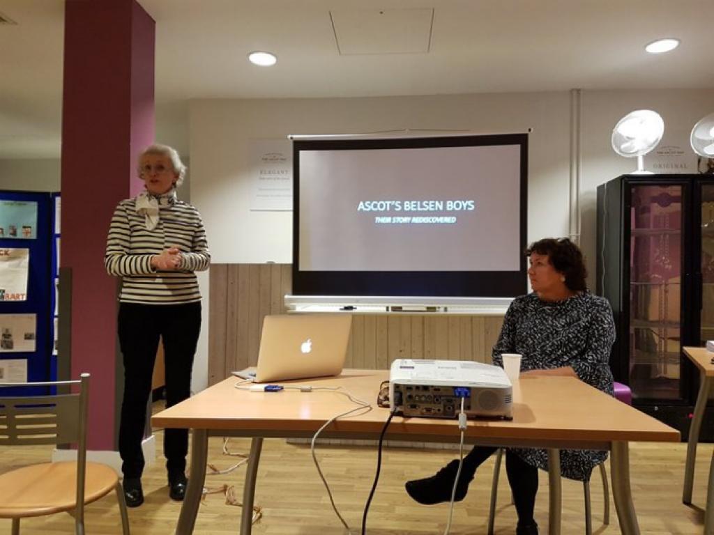 Photograph of Lili Evans and Rosie Whitehouse, the Historian of the '45 Aid Society, presenting the story in Ascot Library