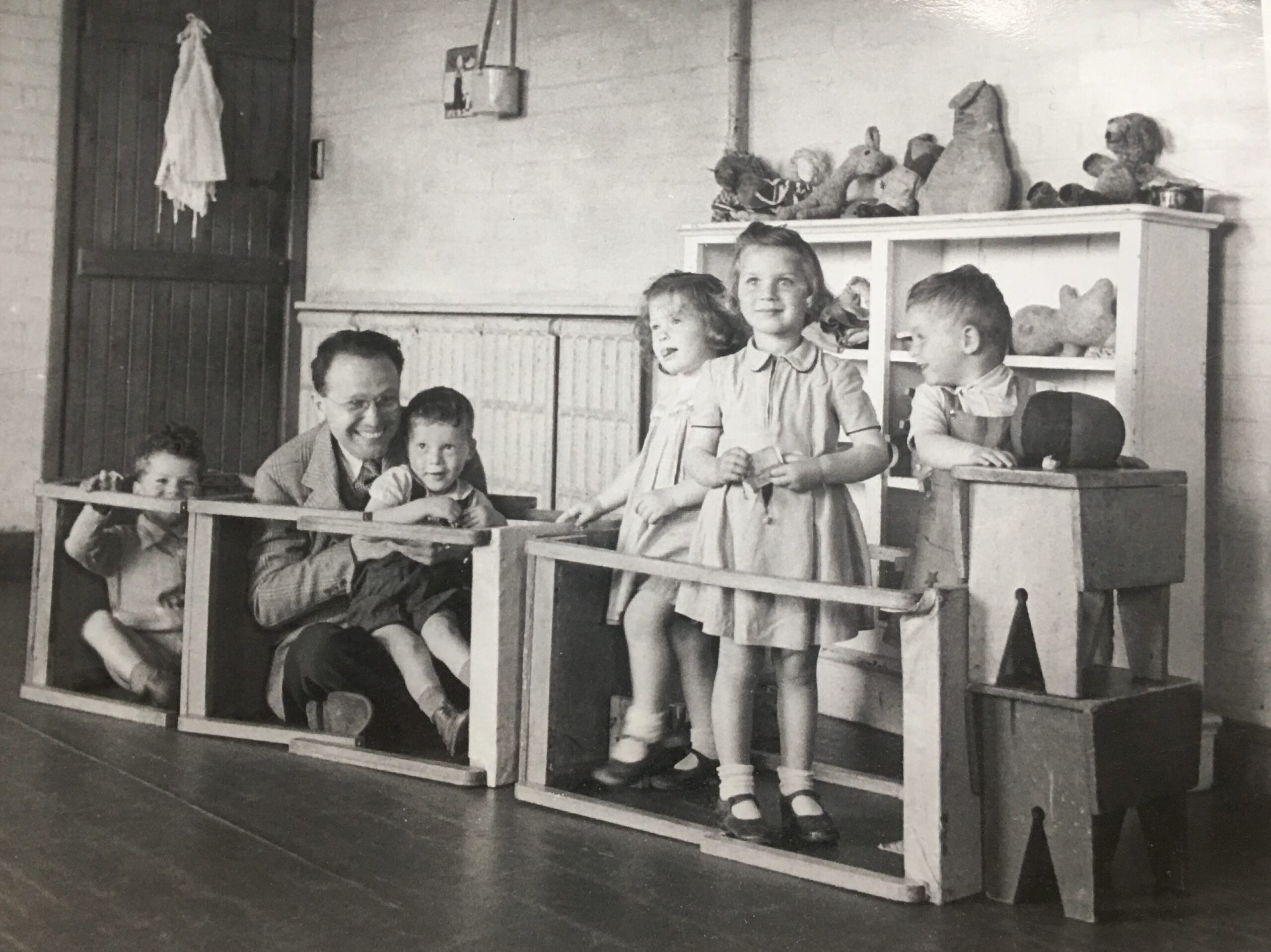 Photograph of the children at Bulldogs Bank with a visiting journalist.