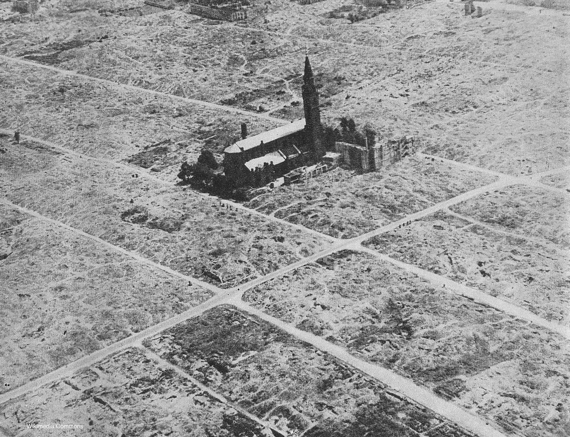 Photograph of the Warsaw Ghetto after the World War II. The surviving church is St Augustine.
