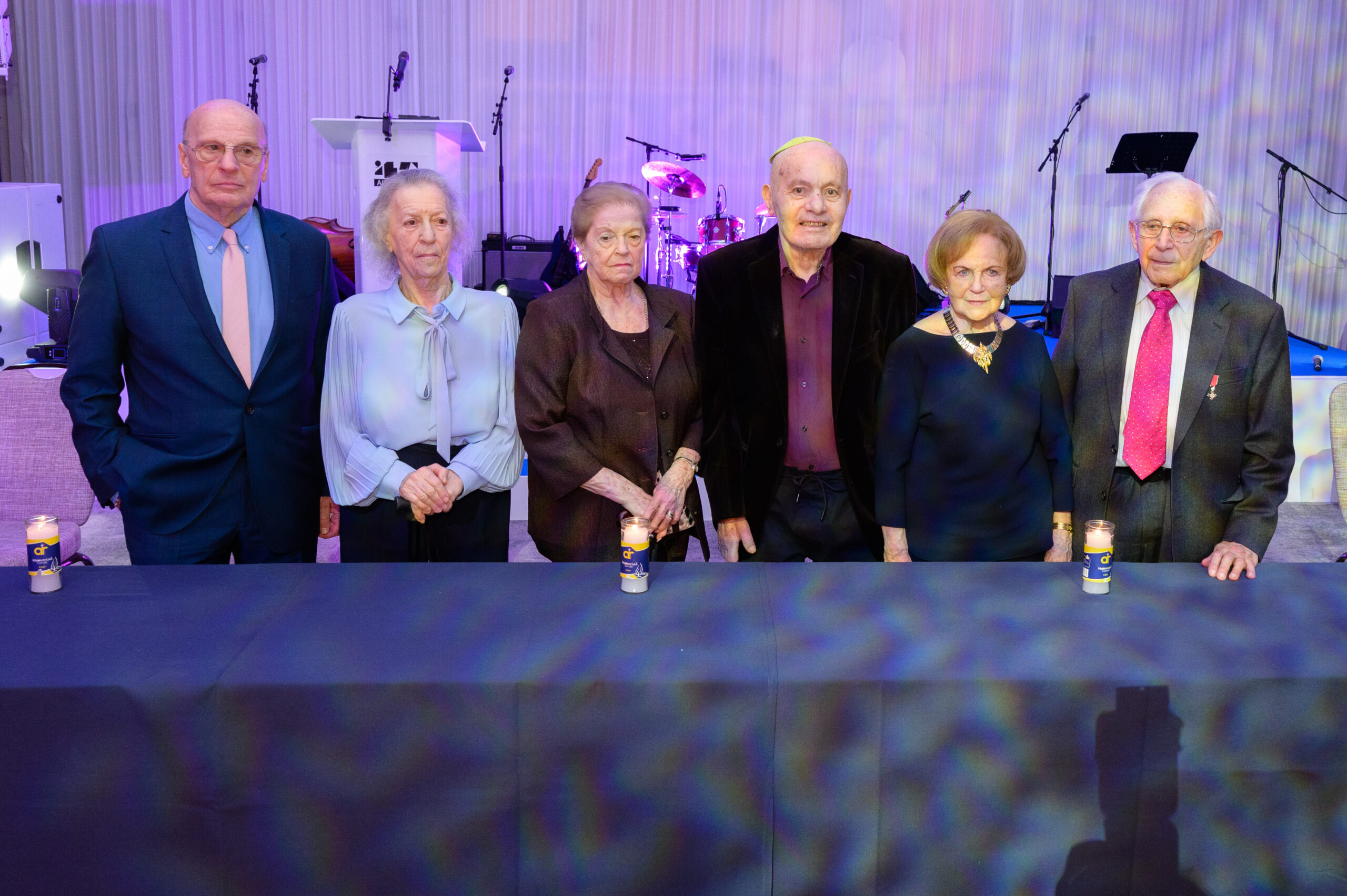 Photograph of memorial candle lighting at the 2023 '45 Aid Society Annual Commemoration Dinner, London, UK.