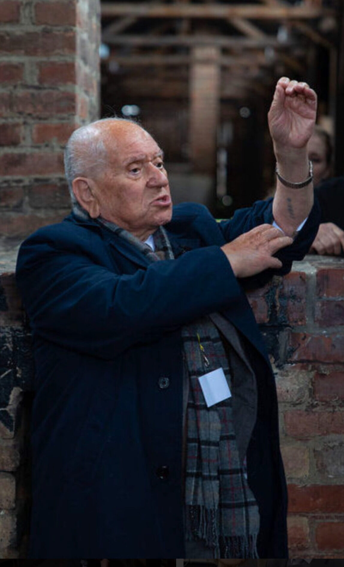 Photograph of Arek Hersch speaking to pupils in Lakes School in Windermere.