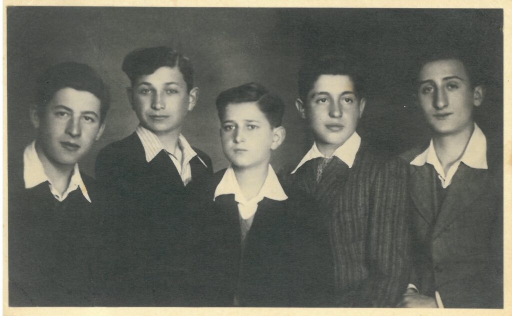 Photograph of Motek Grzmot and cousins.
