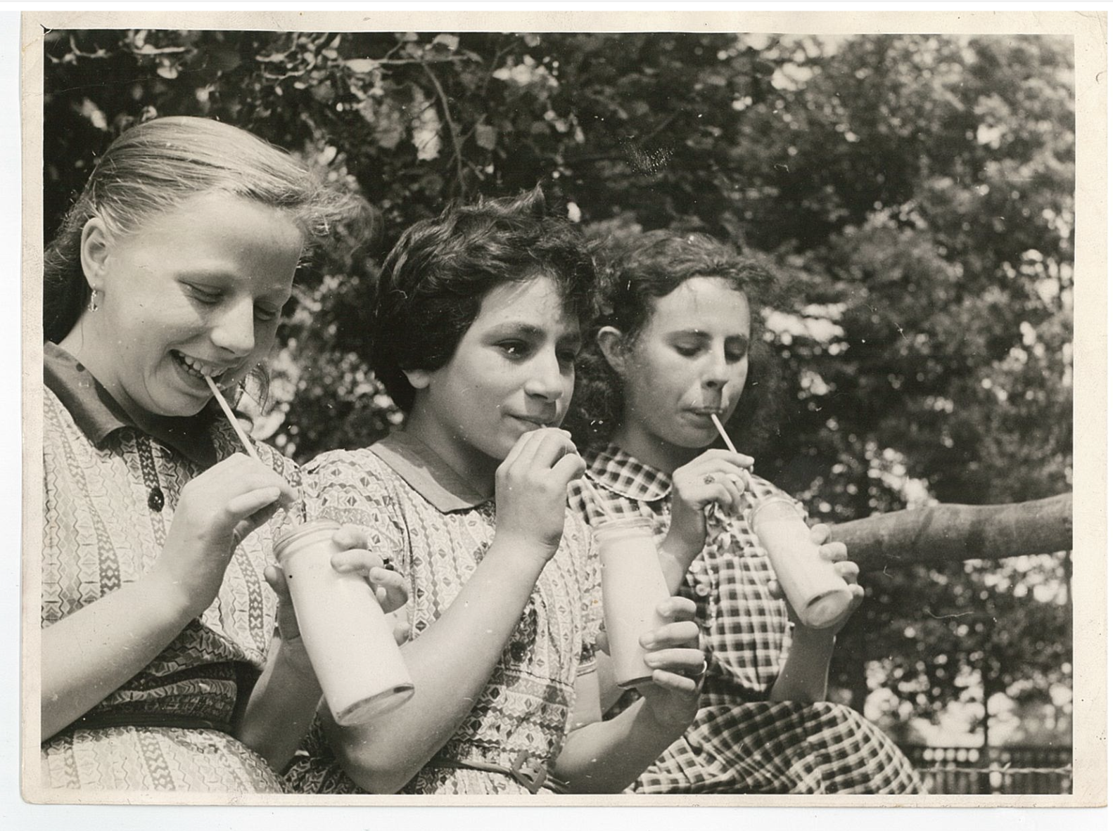 Renate Strauss: three friends sipping milk from straws England ca 1946
