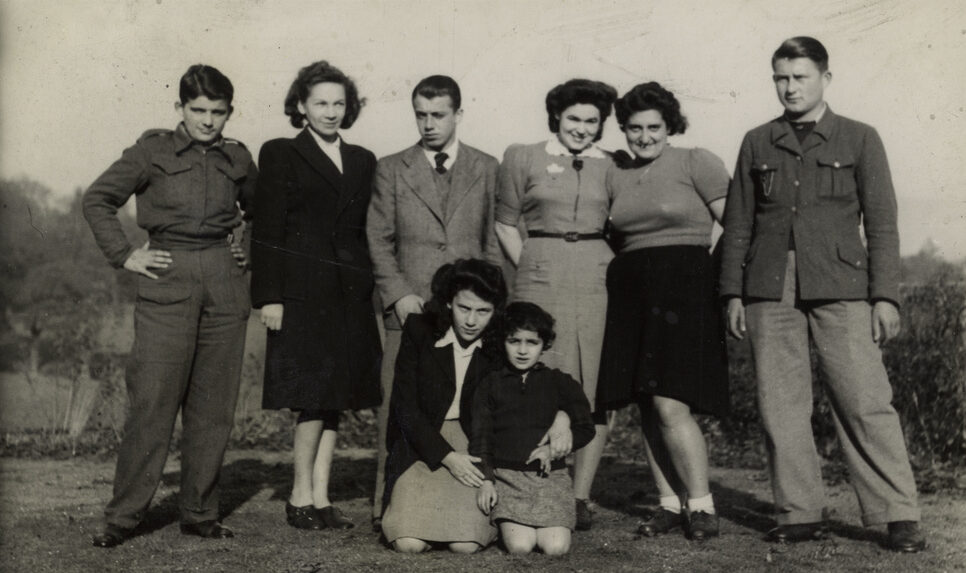 Photograph of Tosca Sussman kneeling in the centre with Judith Singer in Windermere in 1945.